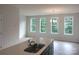 Kitchen with light countertops, dark cabinets, and a sink with window views at 4225 S New Hope Rd # 9, Cramerton, NC 28032