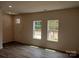 Bright living room with hardwood floors and large windows at 4223 S New Hope Rd # 8, Cramerton, NC 28032
