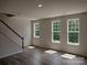 Bright living room with hardwood floors and large windows at 4223 S New Hope Rd # 8, Cramerton, NC 28032