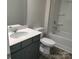 Bathroom with grey vanity, white toilet, and bathtub at 4223 S New Hope Rd # 8, Cramerton, NC 28032