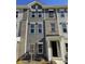 Three-story townhome with gray siding and brick at 4223 S New Hope Rd # 8, Cramerton, NC 28032