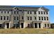 Front view of townhouses with gray and beige siding at 4229 S New Hope Rd # 11, Cramerton, NC 28032