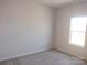 Simple bedroom with neutral wall and carpet, featuring a window at 4229 S New Hope Rd # 11, Cramerton, NC 28032