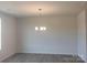 Bright dining room with chandelier and hardwood floors at 4229 S New Hope Rd # 11, Cramerton, NC 28032