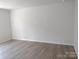 Spacious living room with hardwood floors and large wall at 4229 S New Hope Rd # 11, Cramerton, NC 28032