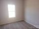 Bright bedroom with neutral walls and carpet, and a window at 4229 S New Hope Rd # 11, Cramerton, NC 28032
