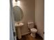 Clean powder room with pedestal sink, toilet, and oval mirror at 4229 S New Hope Rd # 11, Cramerton, NC 28032