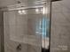 A luxurious shower with marble tile and glass enclosure at 4229 S New Hope Rd # 11, Cramerton, NC 28032