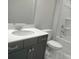 Bathroom features a vanity with dark gray cabinets and a quartz countertop at 4229 S New Hope Rd # 11, Cramerton, NC 28032