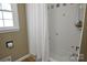 Clean bathroom with shower/tub combo and tile surround at 1003 Athenian Dr, Gastonia, NC 28052