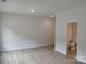 Spacious bedroom with vinyl flooring and attached bathroom at 4227 S New Hope Rd # 10, Cramerton, NC 28032