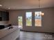 Kitchen with an island, stainless steel appliances, and backyard access at 4227 S New Hope Rd # 10, Cramerton, NC 28032
