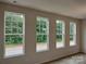 Spacious living room with large windows offering abundant natural light at 4227 S New Hope Rd # 10, Cramerton, NC 28032