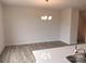 Bright dining room featuring hardwood floors and a modern chandelier at 4227 S New Hope Rd # 10, Cramerton, NC 28032