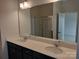 Double vanity bathroom with a large mirror at 4227 S New Hope Rd # 10, Cramerton, NC 28032
