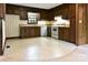 View of kitchen with wood cabinets, tiled floor and white appliances at 165 Clearview Point Dr, Mount Gilead, NC 27306