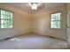 Spacious bedroom with two windows and ceiling fan at 165 Clearview Point Dr, Mount Gilead, NC 27306