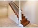 Wooden staircase with white railing at 165 Clearview Point Dr, Mount Gilead, NC 27306