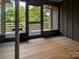 Bright sunroom with access to a deck and wooded views at 165 Clearview Point Dr, Mount Gilead, NC 27306