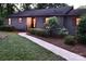 Charming ranch home with landscaped yard, walkway, and red shutters at 165 Clearview Point Dr, Mount Gilead, NC 27306