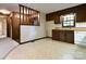 Kitchen offers wood cabinets, tiled floor and a built-in dishwasher at 165 Clearview Point Dr, Mount Gilead, NC 27306