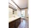 Bathroom features a vanity, toilet, and tiled floor with window at 165 Clearview Point Dr, Mount Gilead, NC 27306