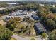 Aerial view showcasing new houses and a pond in a community at 511 Kingsway Cir, Charlotte, NC 28214