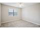 Spacious bedroom with ceiling fan and large window at 494 Glory Ct, Fort Mill, SC 29715