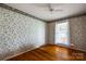 Charming bedroom with wood flooring and floral wallpaper at 3811 Sherer Rd, Sharon, SC 29742