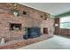 Brick fireplace with a decorative mantel and built-in shelving units on either side at 3811 Sherer Rd, Sharon, SC 29742