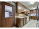 Kitchen with wood cabinets, a built-in microwave, and access to the backyard at 3811 Sherer Rd, Sharon, SC 29742