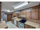 Spacious kitchen featuring wood cabinets, stainless steel appliances, and ample counter space at 3811 Sherer Rd, Sharon, SC 29742