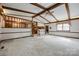 Open living room with high ceilings, exposed beams, and a view into the kitchen area at 3811 Sherer Rd, Sharon, SC 29742