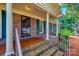 Brick front porch with columns, tiled flooring, and railings at 3811 Sherer Rd, Sharon, SC 29742