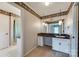 Bathroom with a vanity sink, striped wallpaper, and a shower/tub combo at 3811 Sherer Rd, Sharon, SC 29742