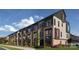 Modern townhomes with brick and dark accents at 1017 North End Dr # 27, Charlotte, NC 28206