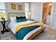 Cozy bedroom with a cane headboard and ensuite bathroom at 1017 North End Dr # 27, Charlotte, NC 28206