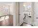 Bathroom with pedestal sink, toilet and checkered floor at 615 Peach St, Shelby, NC 28150