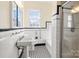 Classic bathroom with white tile and pedestal sink at 615 Peach St, Shelby, NC 28150