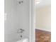 Bathroom with white tile shower and bathtub at 615 Peach St, Shelby, NC 28150
