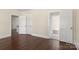 Bedroom with hardwood floors and access to hallway at 615 Peach St, Shelby, NC 28150