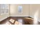 Bright bedroom with hardwood floors and large windows at 615 Peach St, Shelby, NC 28150
