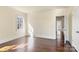 Bedroom with hardwood floors, natural light and access to hallway at 615 Peach St, Shelby, NC 28150
