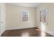 Bright bedroom with hardwood floors and large windows at 615 Peach St, Shelby, NC 28150