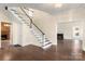 Elegant entryway with hardwood floors and curved staircase at 615 Peach St, Shelby, NC 28150