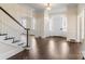 Bright entryway with hardwood floors and grand staircase at 615 Peach St, Shelby, NC 28150