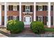 Classic front entrance with columns and a white door at 615 Peach St, Shelby, NC 28150
