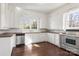 Galley kitchen with white cabinets and stainless steel appliances at 615 Peach St, Shelby, NC 28150