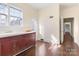 Kitchen features wood cabinets and access to hallway at 615 Peach St, Shelby, NC 28150