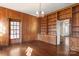Cozy library with wood paneling and built-in shelving at 615 Peach St, Shelby, NC 28150
